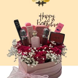 Luxury pink heart-shaped gift box filled with fresh red roses, Kayali perfume, Dior blush, NARS makeup, and Kiko Milano cosmetics.