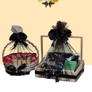 Matching pair of luxury gift hampers in black and gold themes; one contains men's skincare and grooming products, the other contains fine chocolates.